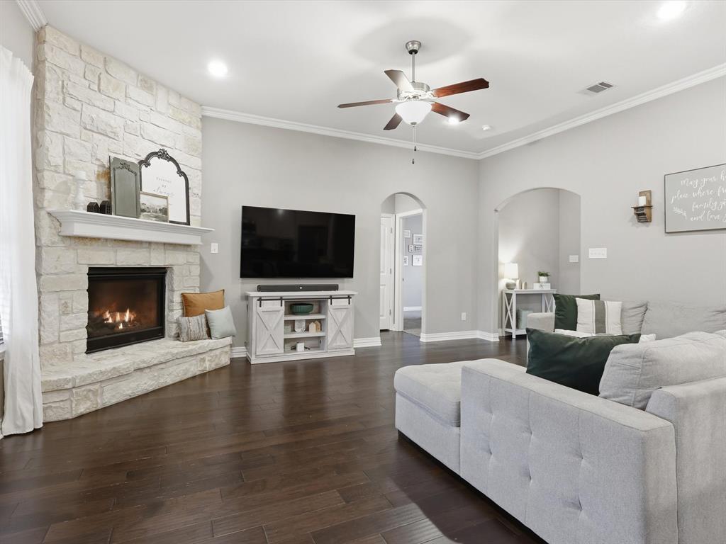 810 Chestnut Grove Drive Cleburne, TX 76033 - Photo 17 of 40 a living room with furniture fireplace and flat screen tv