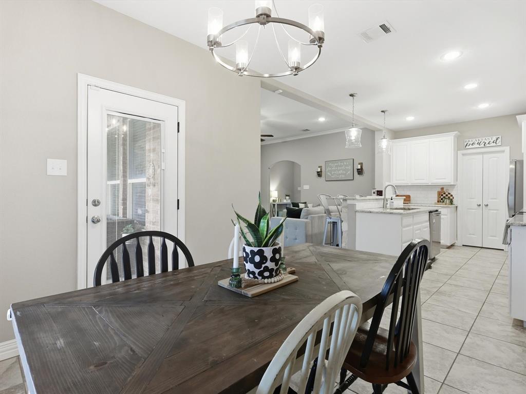 810 Chestnut Grove Drive Cleburne, TX 76033 - Photo 27 of 40 a view of a dining room with furniture