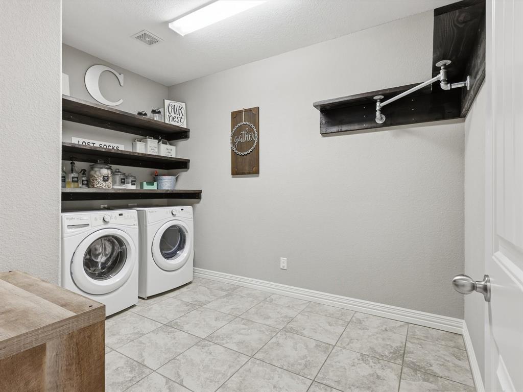810 Chestnut Grove Drive Cleburne, TX 76033 - Photo 28 of 40 a utility room with dryer and washer