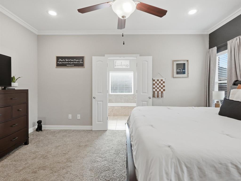 810 Chestnut Grove Drive Cleburne, TX 76033 - Photo 31 of 40 a bedroom with a bed and a dresser