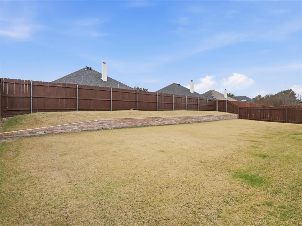 810 Chestnut Grove Drive Cleburne, TX 76033 - Photo 39 of 40 a view of an outdoor space and tv
