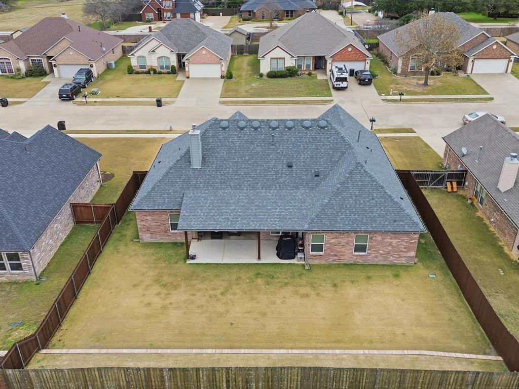 810 Chestnut Grove Drive Cleburne, TX 76033 - Photo 5 of 40 a view of a swimming pool with a lawn chairs