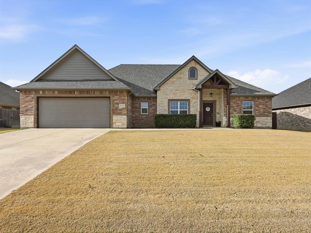 810 Chestnut Grove Drive Cleburne, TX 76033 - Photo 7 of 40 a front view of house with yard and garage