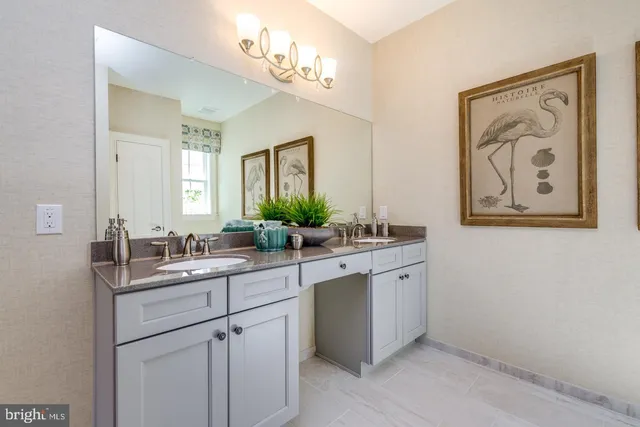 a bathroom with a double vanity sink and a mirror
