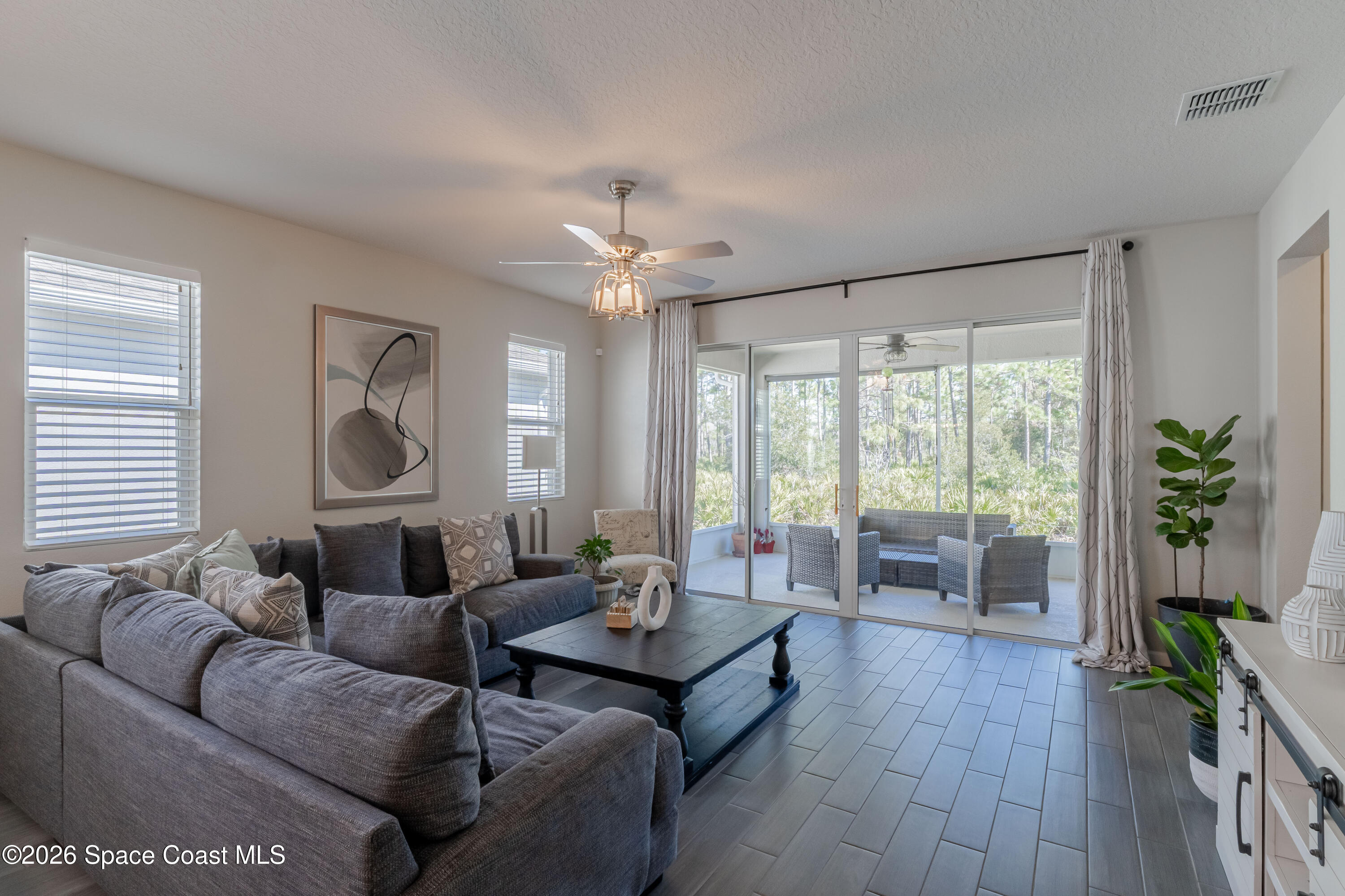 4342 Southern Vista Loop St. Cloud, FL 34772 - Photo 11 of 30 a living room with furniture and a large window