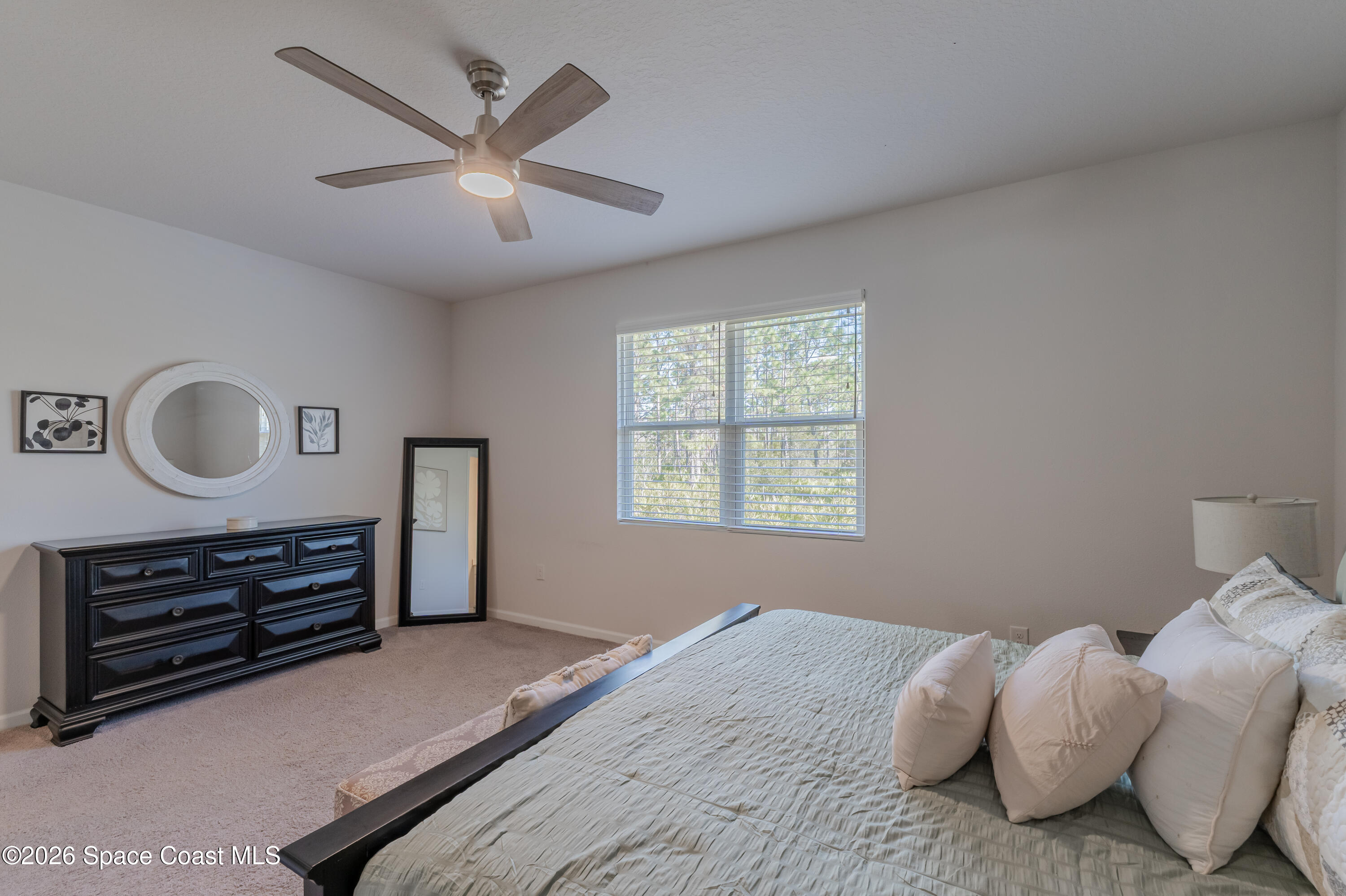 4342 Southern Vista Loop St. Cloud, FL 34772 - Photo 16 of 30 a bedroom with bed and a window