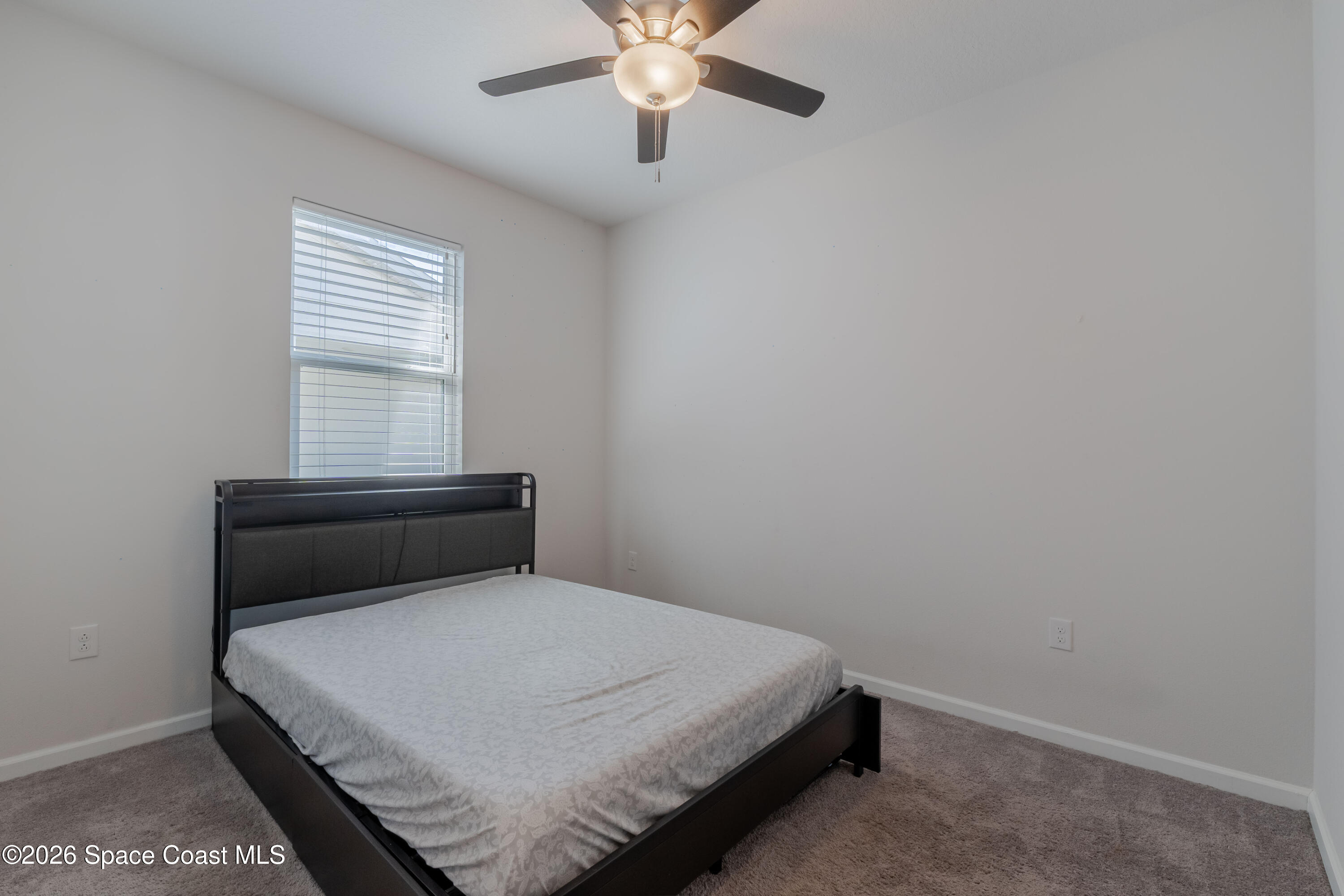 4342 Southern Vista Loop St. Cloud, FL 34772 - Photo 22 of 30 a bedroom with a bed and window