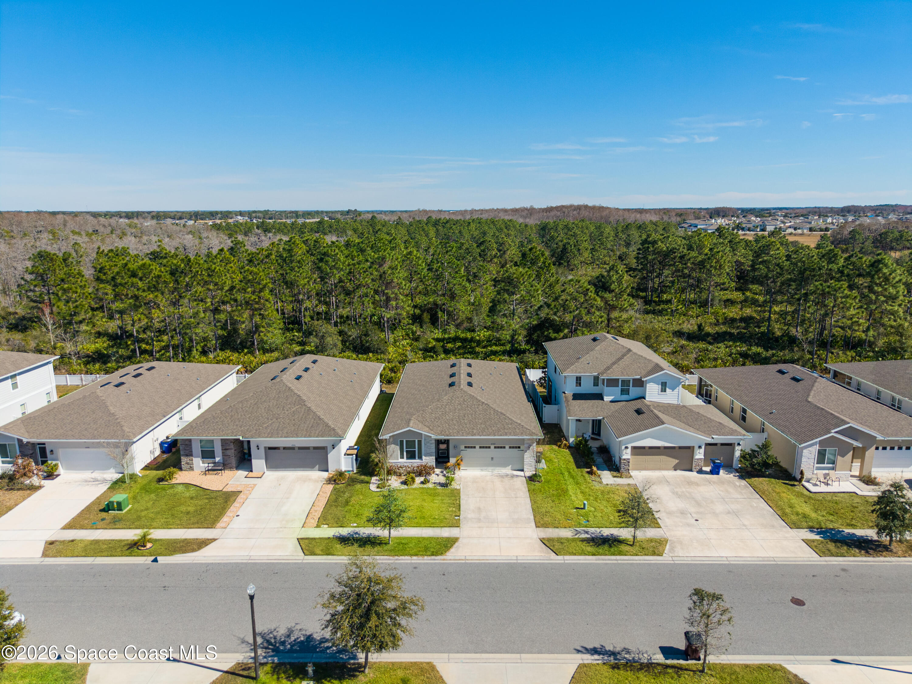 4342 Southern Vista Loop St. Cloud, FL 34772 - Photo 27 of 30 an aerial view of residential houses with outdoor space and street view