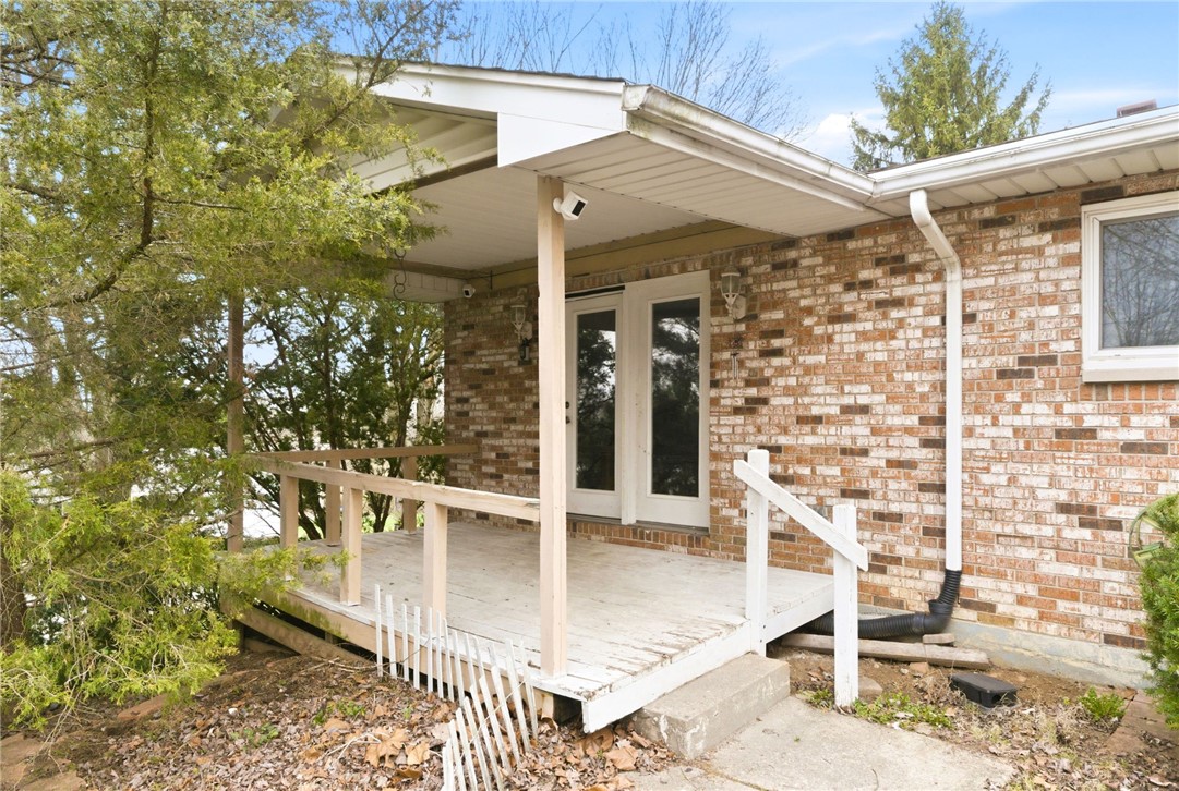6711 Hamilton-Middletown Road Franklin, OH 45005 - Photo 31 of 49 This charming residence features a classic brick exterior and an inviting porch perfect for relaxation.