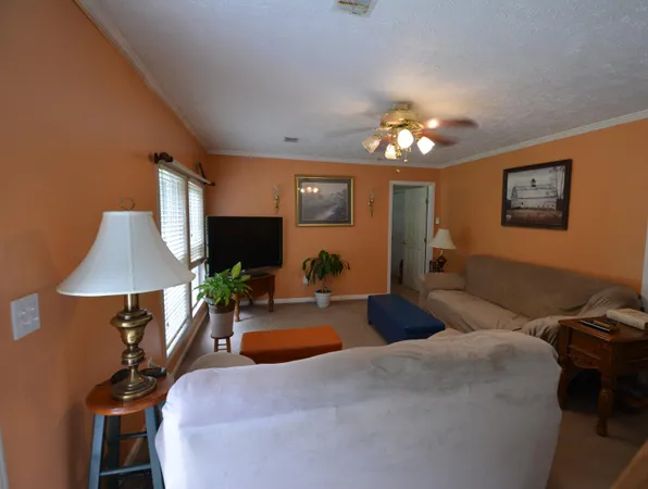a bedroom with furniture and a chandelier