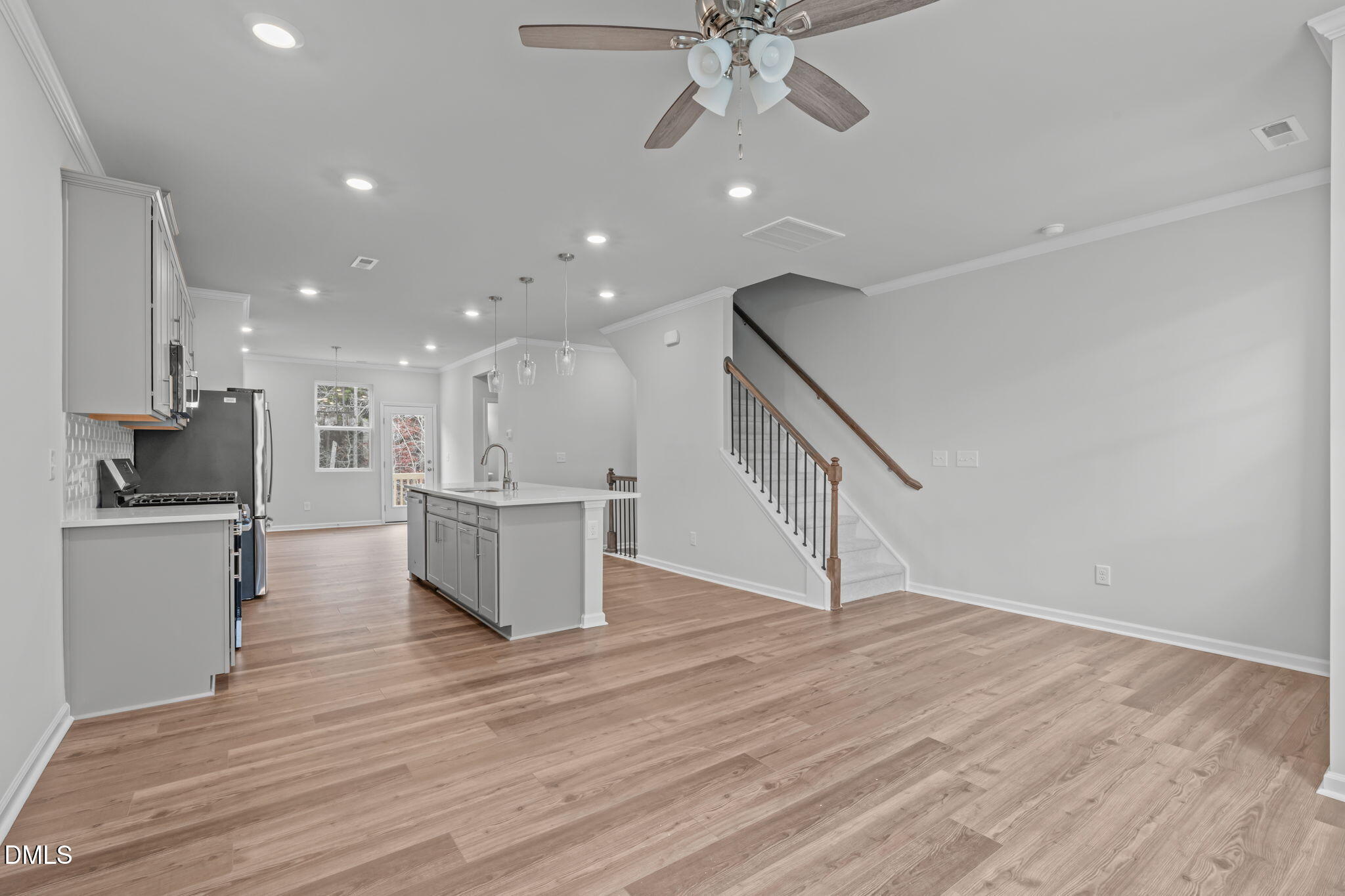 504 Light Oak Way Apex, NC 27539 - Photo 20 of 38 a view of kitchen with cabinets and wooden floor