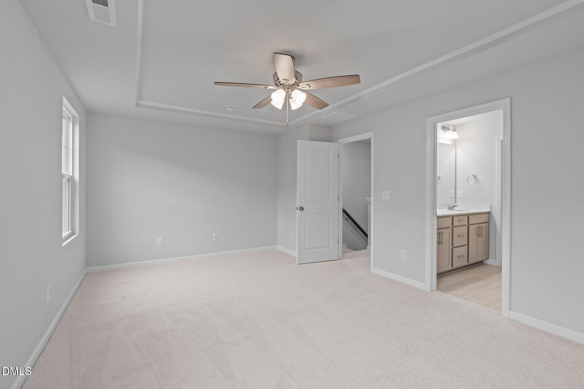 504 Light Oak Way Apex, NC 27539 - Photo 28 of 38 an empty room with closet and a ceiling fan