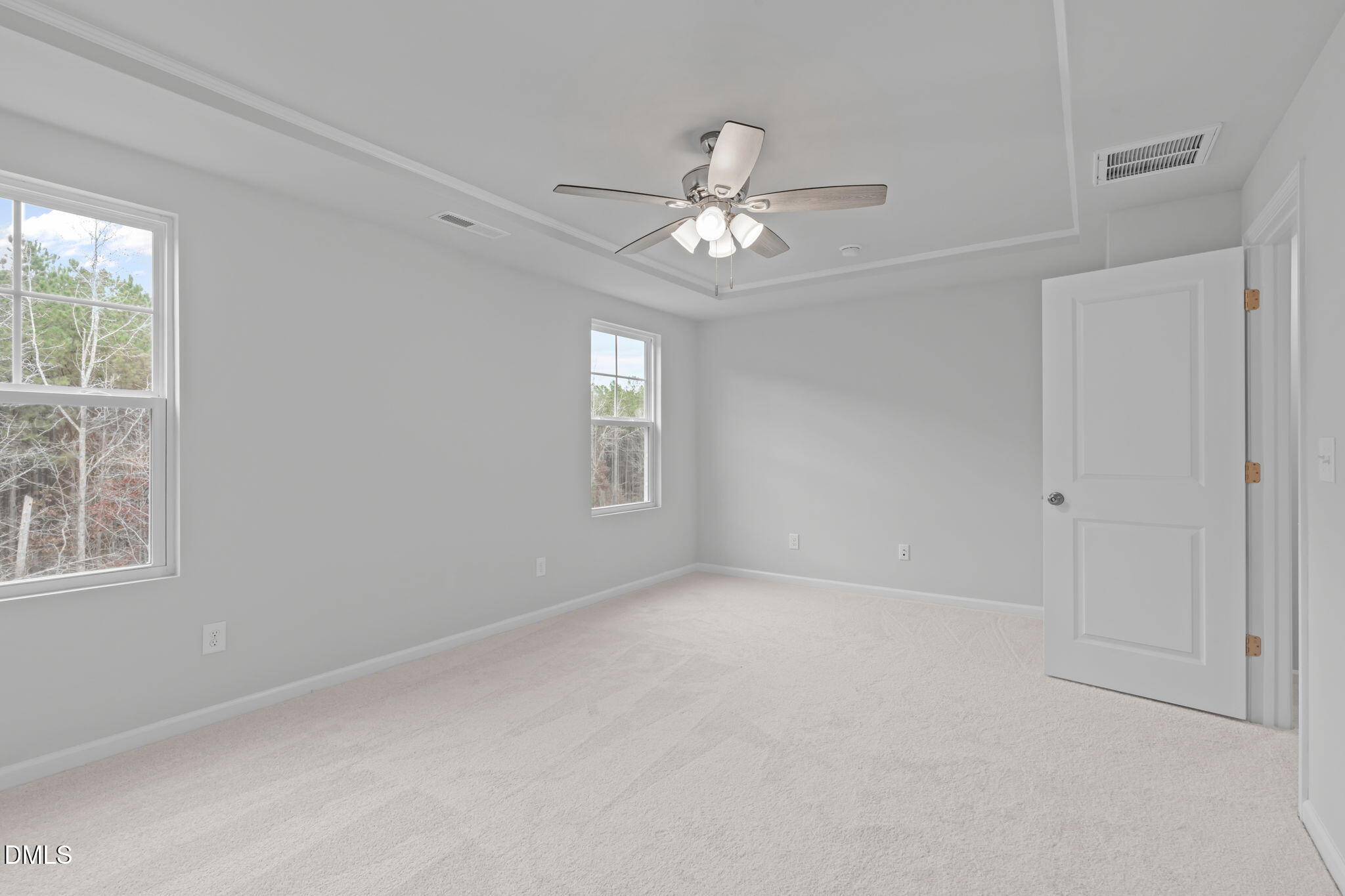 504 Light Oak Way Apex, NC 27539 - Photo 29 of 38 an empty room with windows and fan