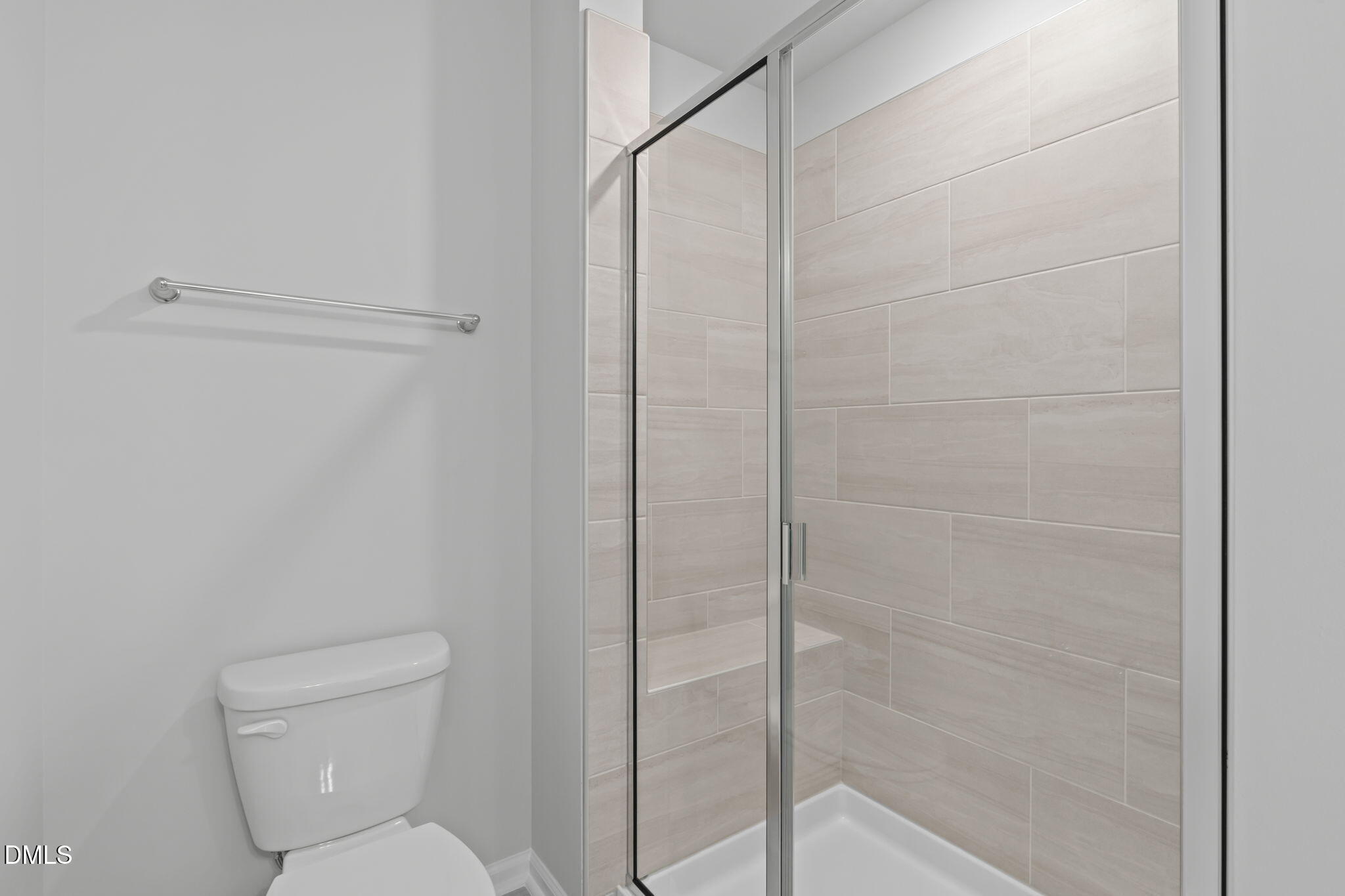 504 Light Oak Way Apex, NC 27539 - Photo 31 of 38 a bathroom with a toilet and shower