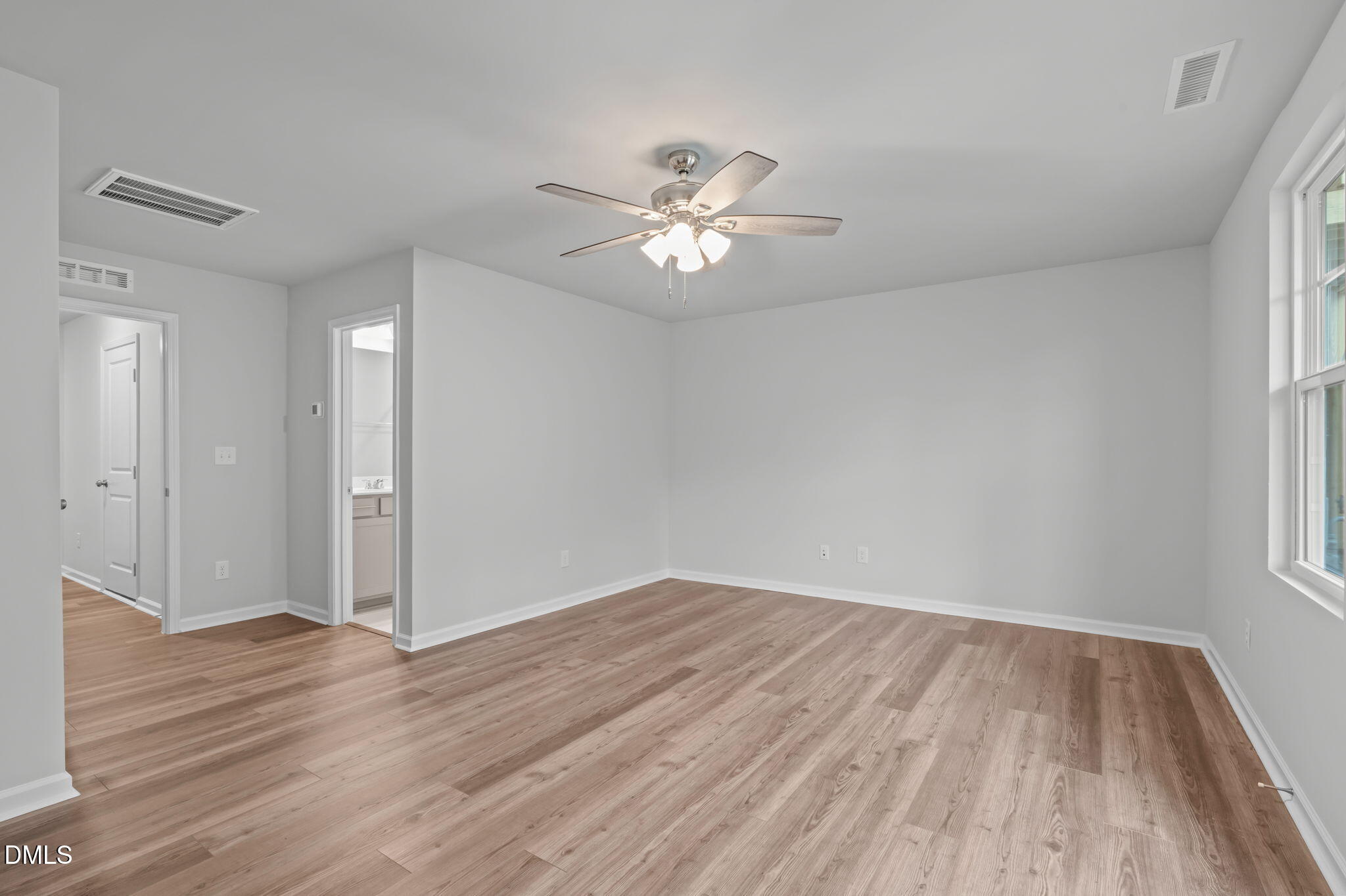 504 Light Oak Way Apex, NC 27539 - Photo 7 of 38 wooden floor in an empty room with a window