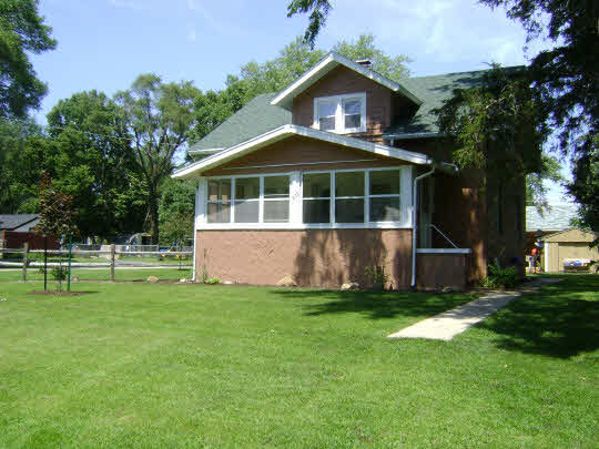 502 Barry Road Rockford, IL 61109 - Photo 1 of 9 a front view of house with yard and green space