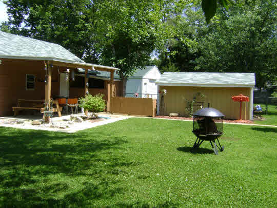 502 Barry Road Rockford, IL 61109 - Photo 2 of 9 a view of a chair and table in backyard of the house