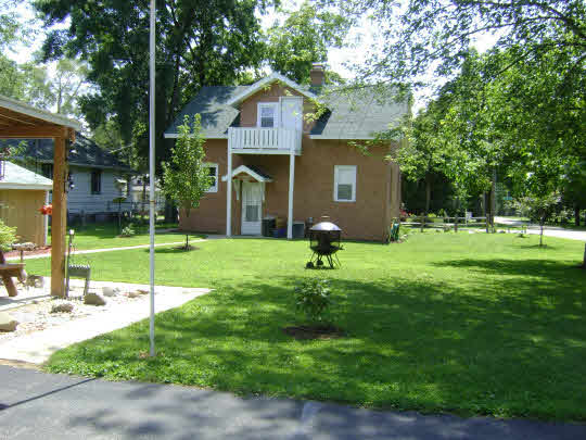 502 Barry Road Rockford, IL 61109 - Photo 3 of 9 a view of a house with a yard and sitting area
