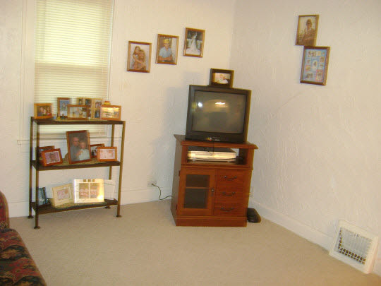 502 Barry Road Rockford, IL 61109 - Photo 8 of 9 a room with furniture and a flat screen tv