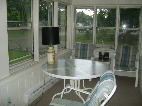 502 Barry Road Rockford, IL 61109 - Photo 9 of 9 a living room with a table and chairs