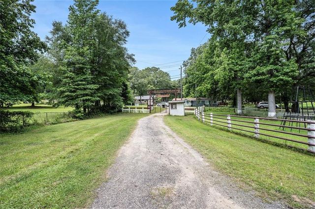 a view of a park with large trees