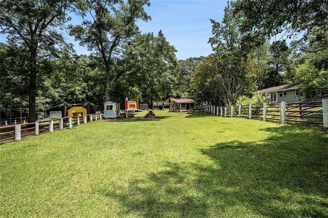a view of a swimming pool with a table and chairs