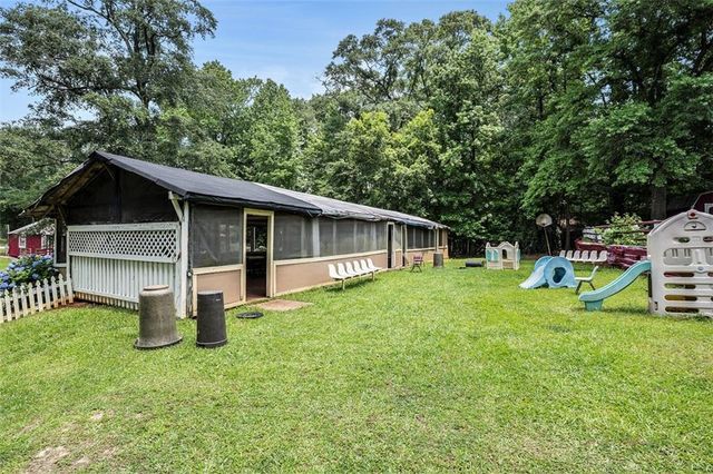 a house view with a backyard space