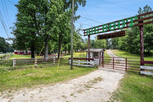 a view of a park with large trees