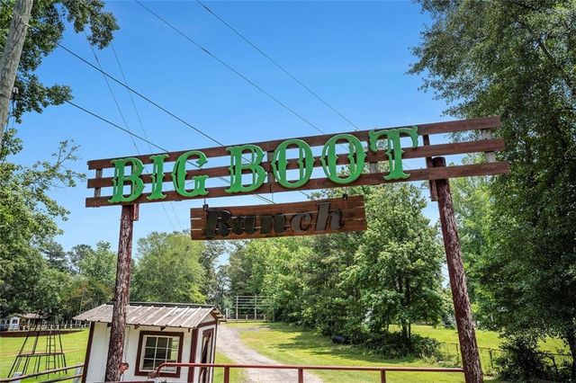 a view of a chairs and table in the patio