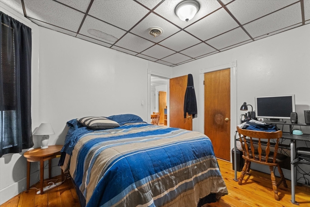15 Steele Street Worcester, MA 01607 - Photo 18 of 42 a bedroom with a bed and a flat screen tv