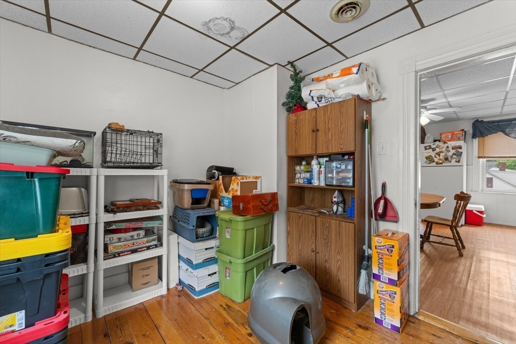 15 Steele Street Worcester, MA 01607 - Photo 19 of 42 a room with furniture and a book shelf
