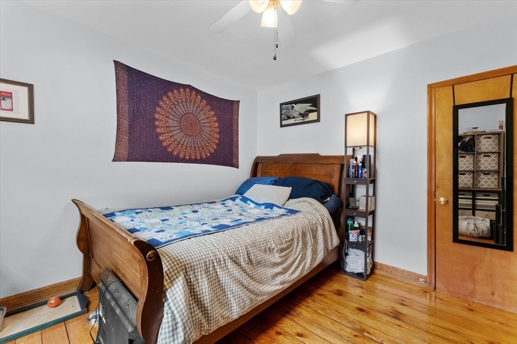 15 Steele Street Worcester, MA 01607 - Photo 7 of 42 a bedroom with a bed and a painting on the wall