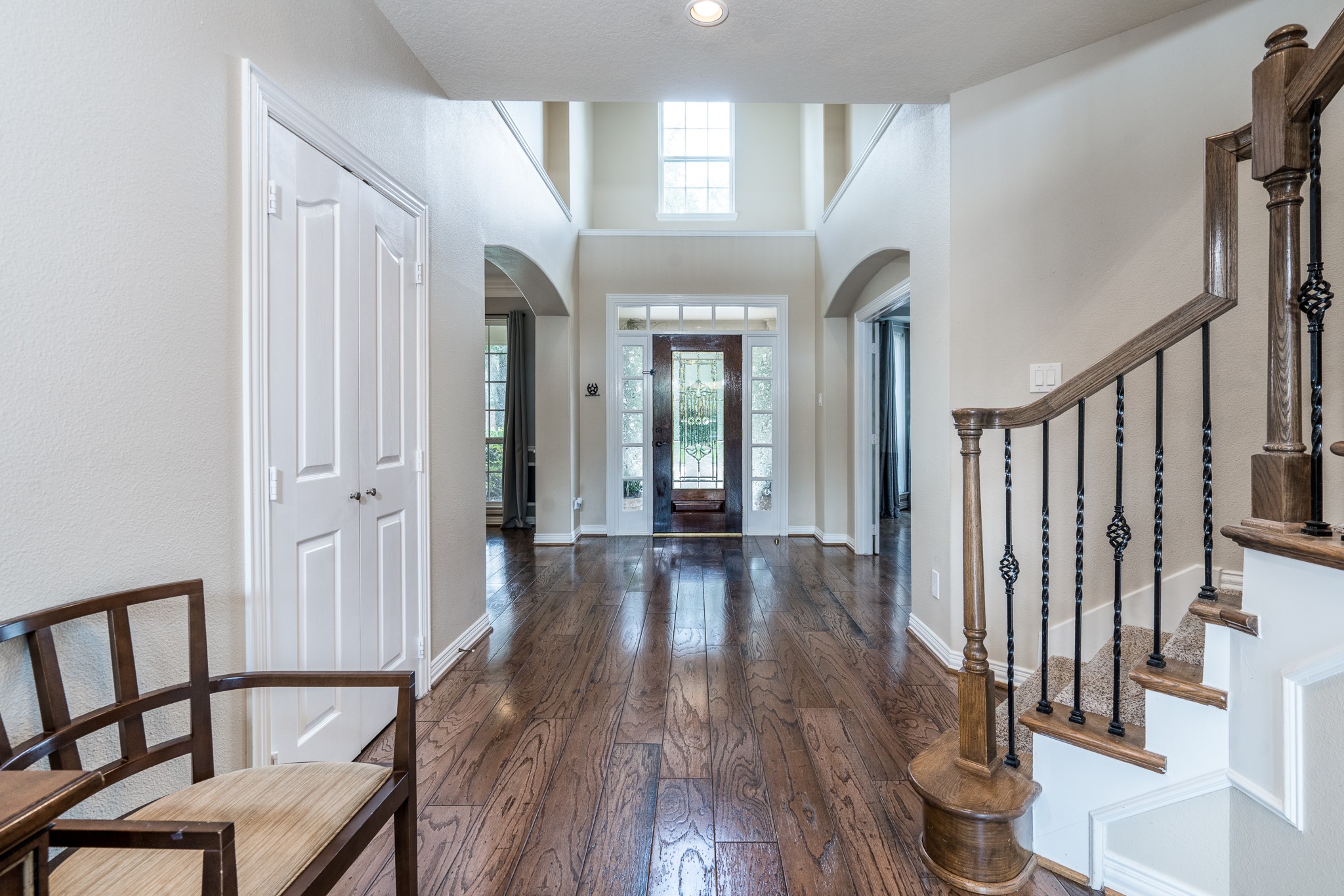 5914 Oakmoss Trail Spring, TX 77379 - Photo 6 of 50 Wonderful natural light flows into the 2-story entry creating a warm and inviting atmosphere! The window above the door, side light windows and the leaded glass door all add to the amazing glow!...