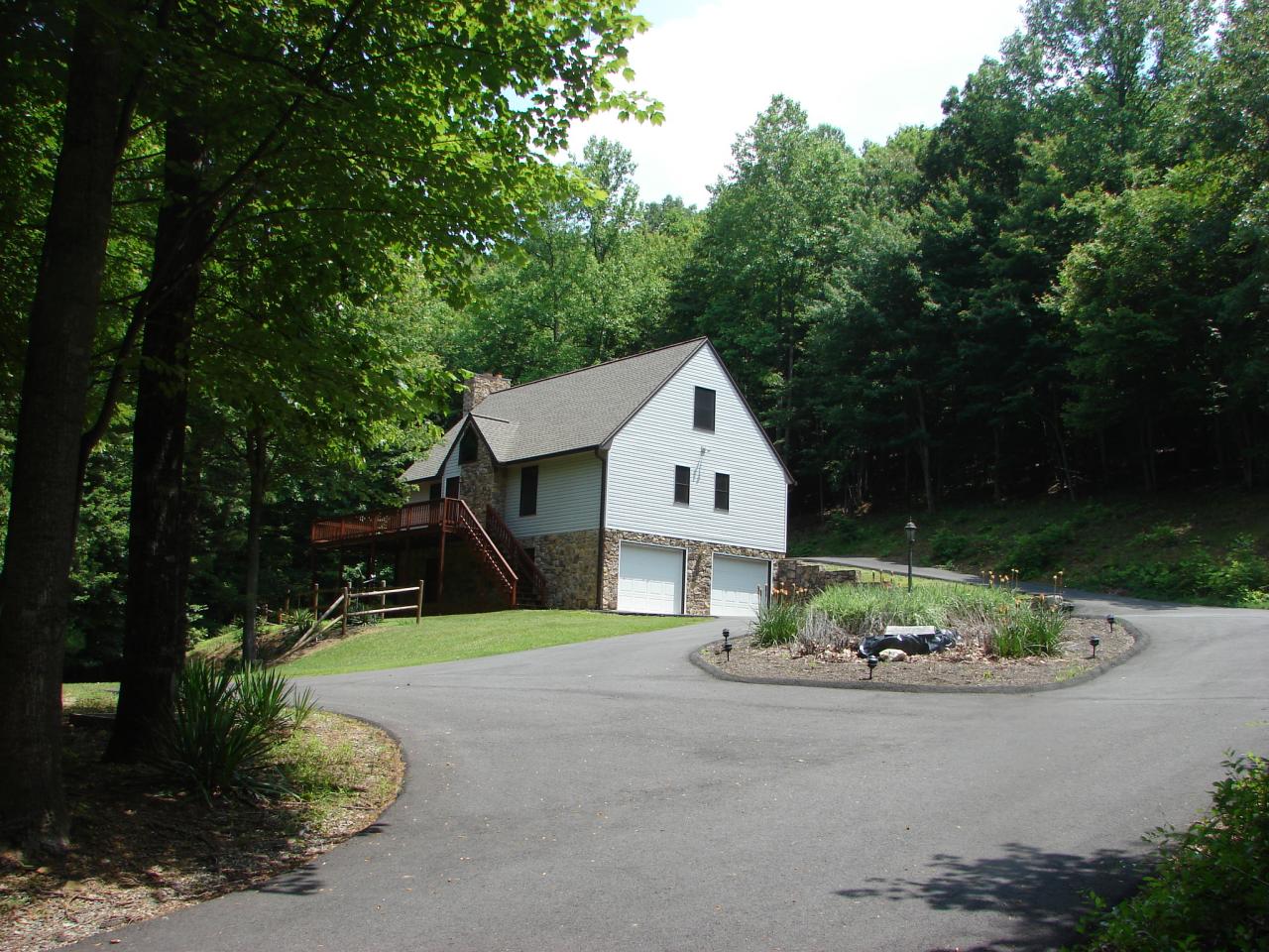11 Silver Shadow Road Hardy, VA 24101 - Photo 18 of 18 a front view of a house with a yard and garage
