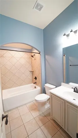 a bathroom with a sink a toilet and bathtub