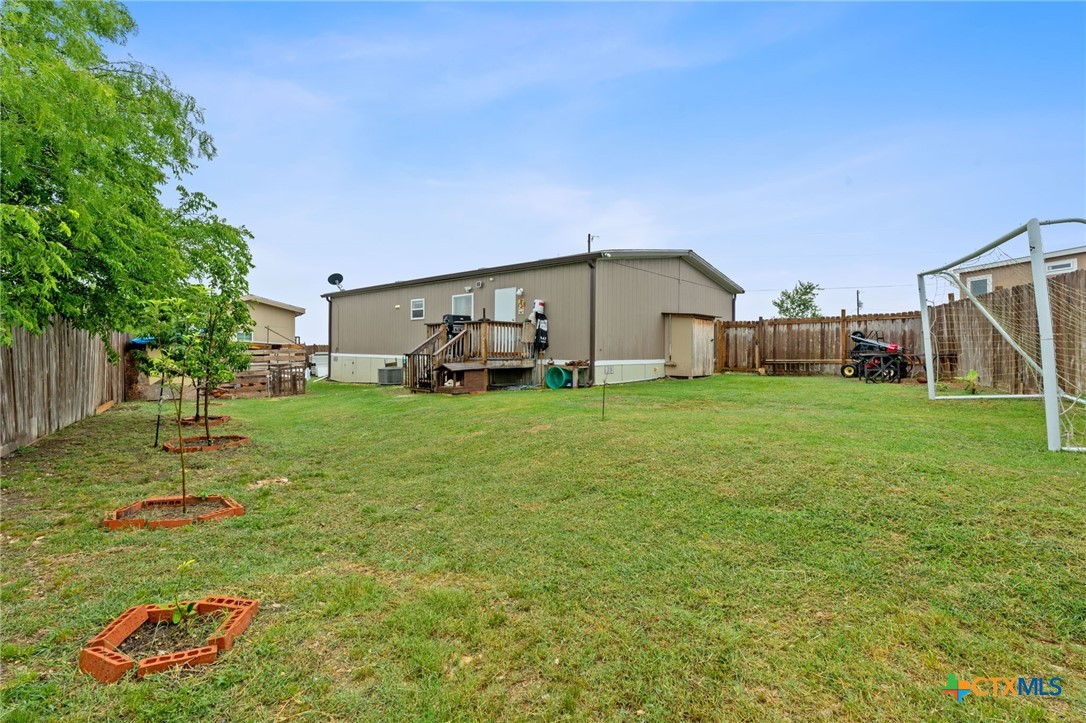 121 Fate Court Kyle, TX 78640 - Photo 23 of 23 a view of a house with a yard and sitting area