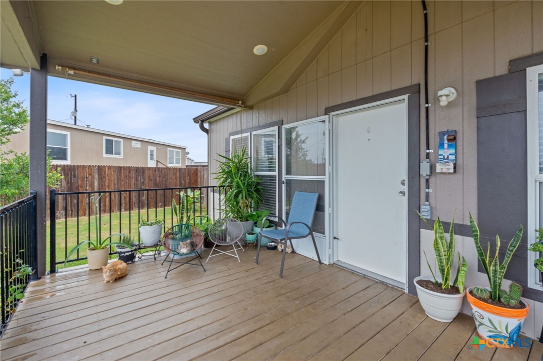121 Fate Court Kyle, TX 78640 - Photo 4 of 23 a view of deck with patio