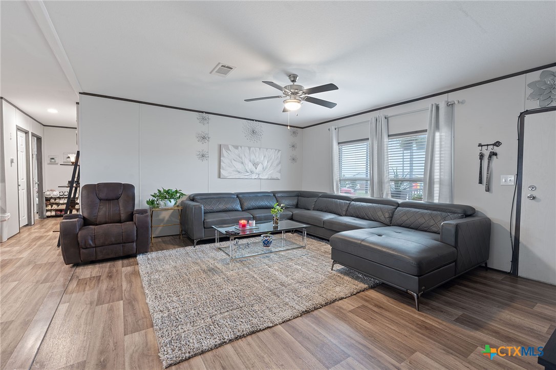 121 Fate Court Kyle, TX 78640 - Photo 5 of 23 a living room with furniture and wooden floor