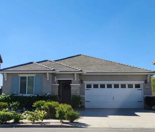 a front view of a house with a garage