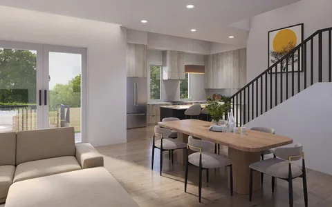 a view of a livingroom with furniture and window