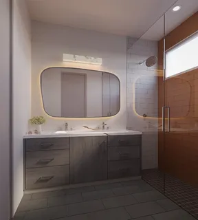 a bathroom with a double vanity sink and mirror
