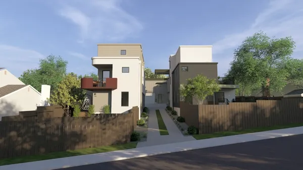 a front view of a house with trees