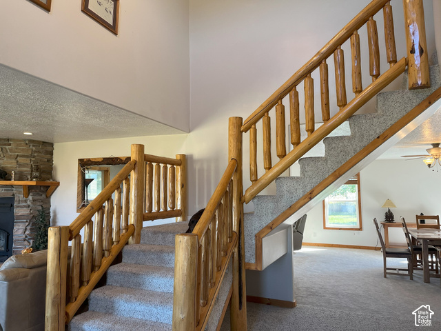 750 South Big Road Soda Springs, ID 83276 - Photo 27 of 40 Elegant open staircase featuring substantial wood railings and balusters, anchoring the two-story foyer