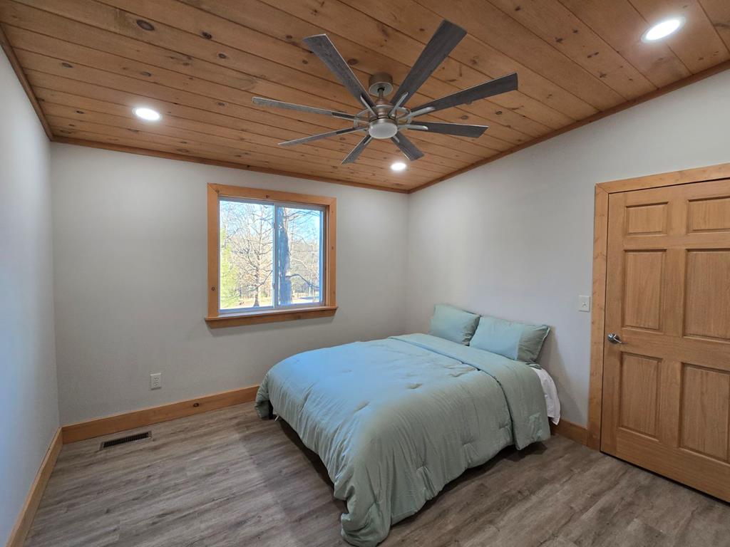 2417 Mobile Road McCaysville, GA 30555 - Photo 10 of 17 a bedroom with a bed and a window