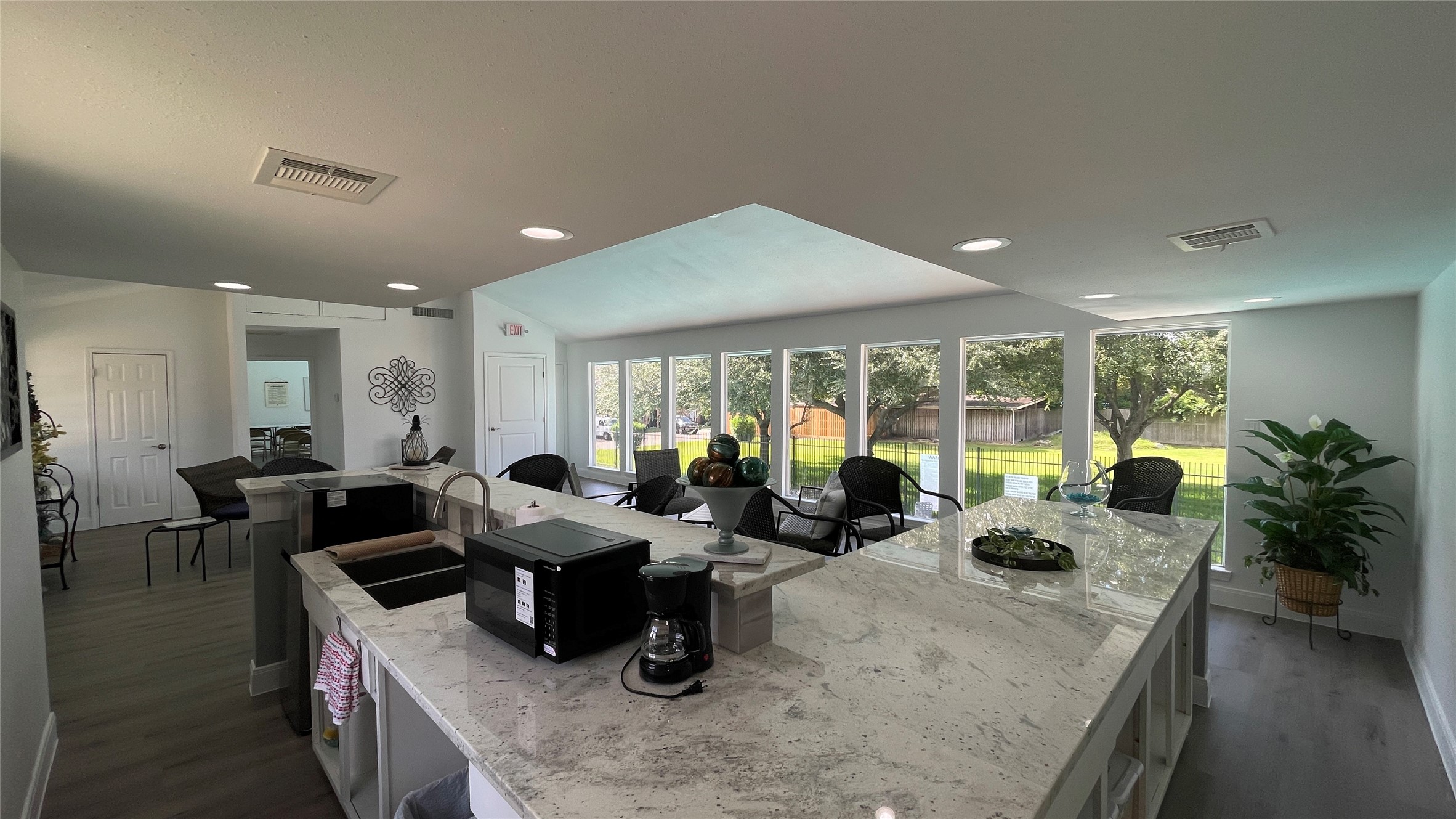 14641 Perthshire Road Houston, TX 77079 - Photo 33 of 37 View of the kitchen in the recently renovated club house. The grassy area in the background is a large subdivision greenspace that's popular with dog walkers.