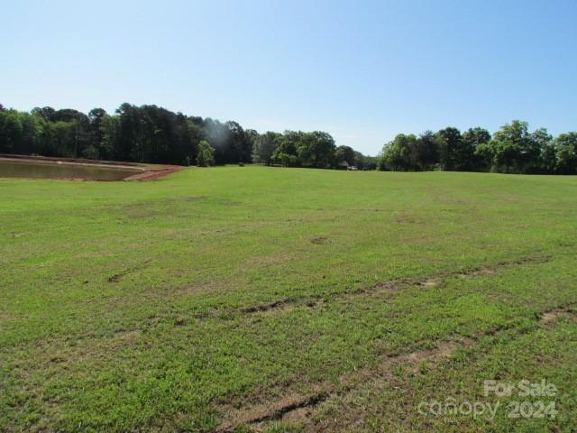 0 Tanner Street Rutherfordton, NC 28139 - Photo 3 of 3 a view of a field with grass and trees in the background