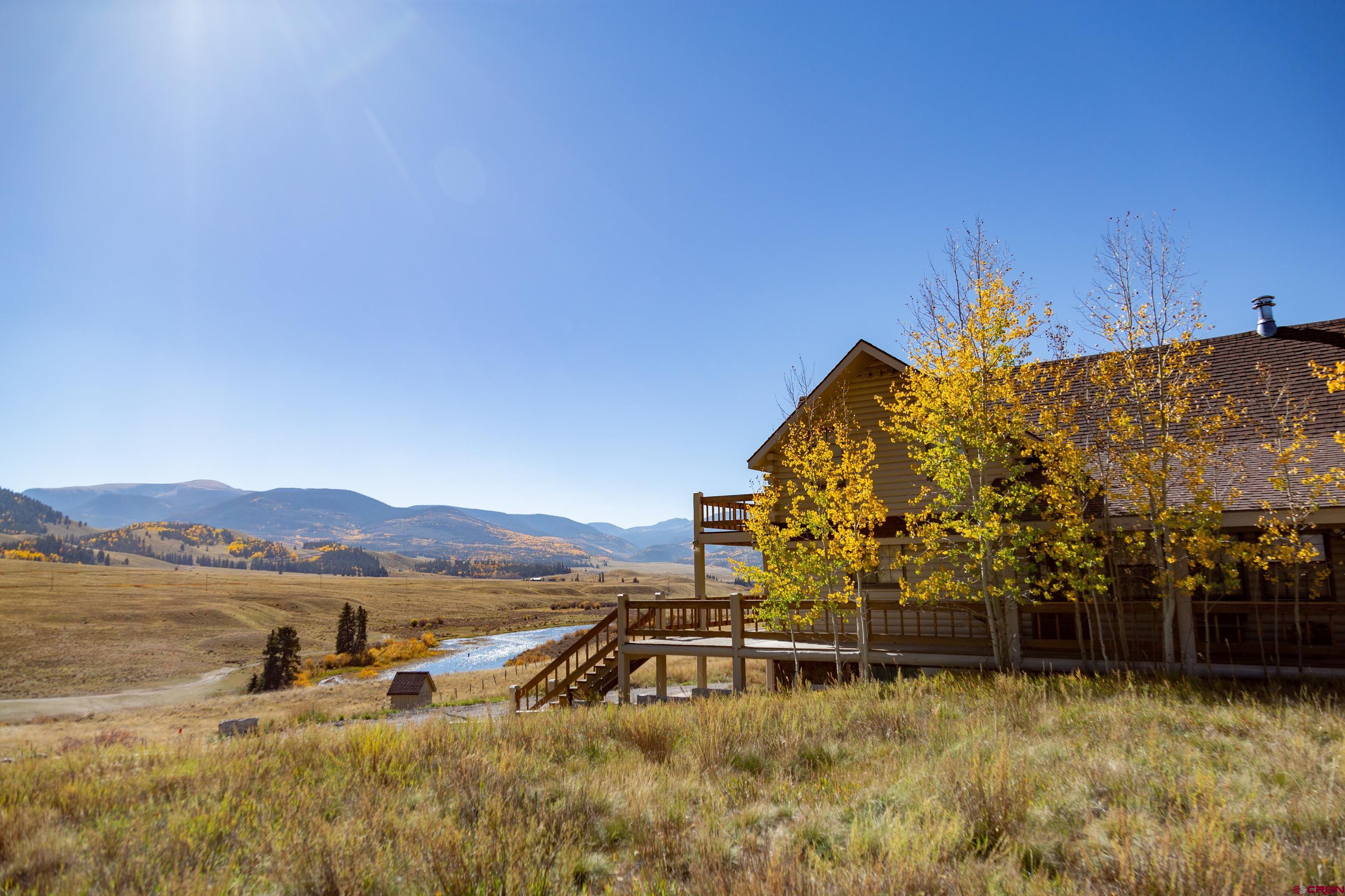 516 Rio Grande Court Creede, CO 81130 - Photo 1 of 33 a view of a lake with a mountain in the background