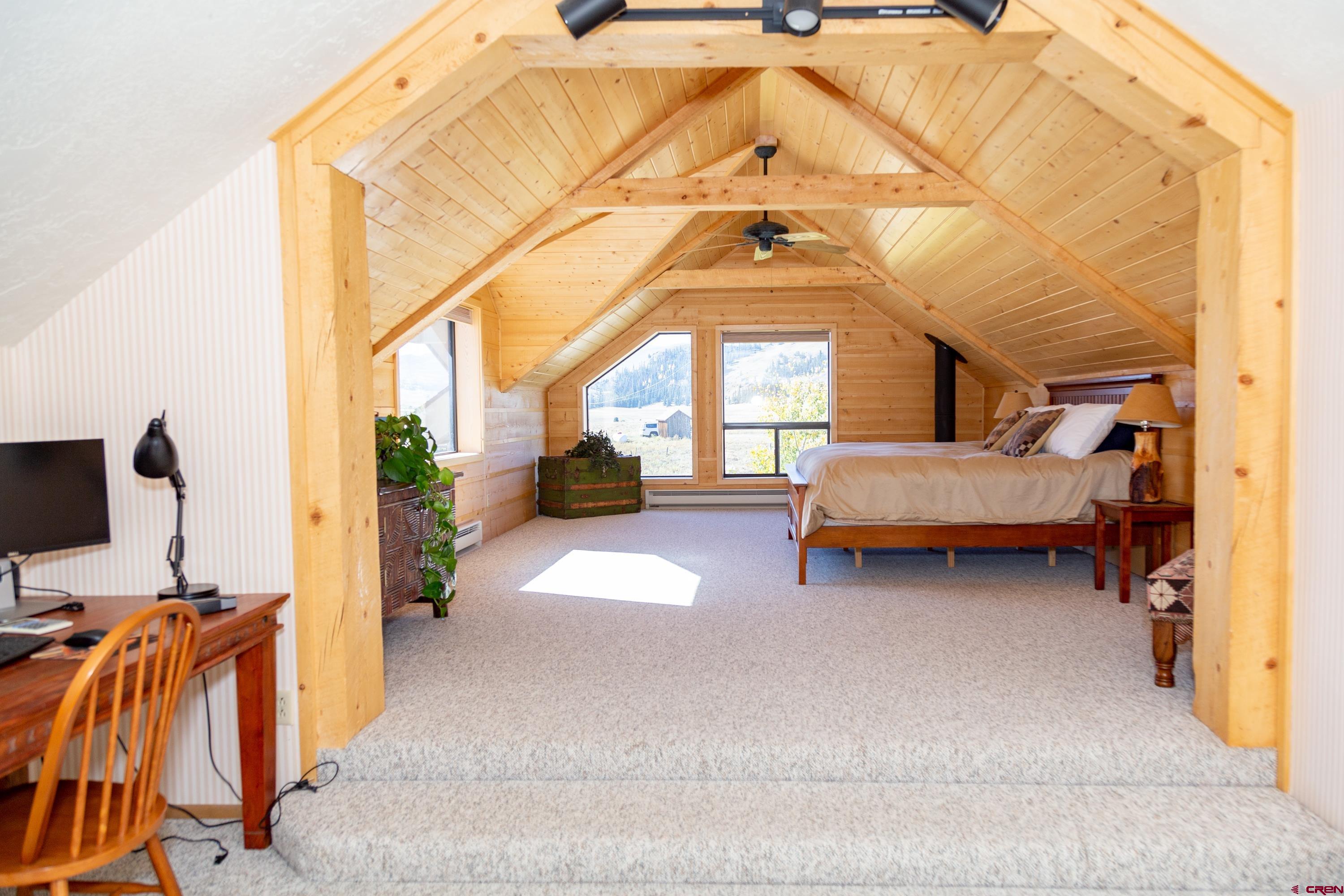 516 Rio Grande Court Creede, CO 81130 - Photo 20 of 33 a bedroom with a bed and a window