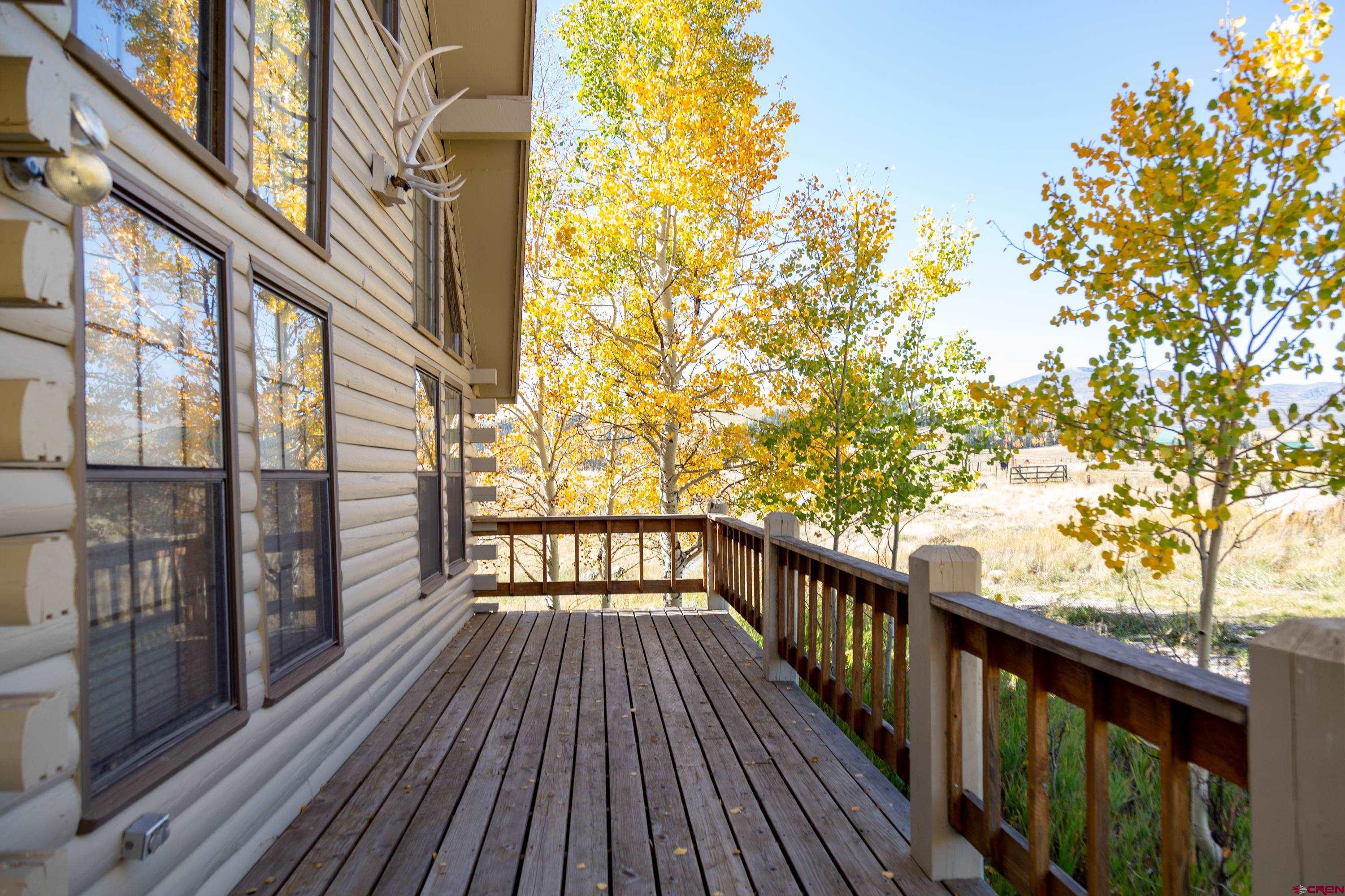 516 Rio Grande Court Creede, CO 81130 - Photo 2 of 33 a view of a balcony with wooden floor and fence
