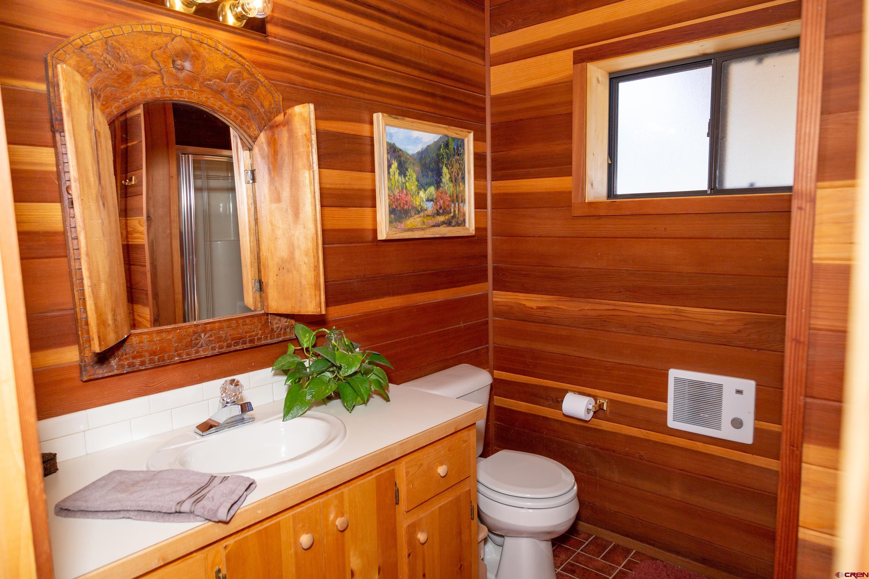 516 Rio Grande Court Creede, CO 81130 - Photo 22 of 33 a bathroom with a sink a toilet and shower
